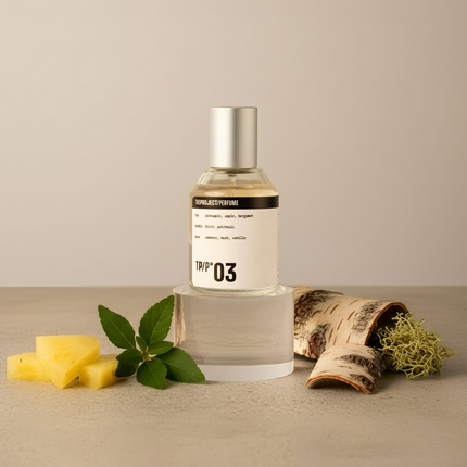 Perfume bottle labeled '03' with natural elements on a beige background