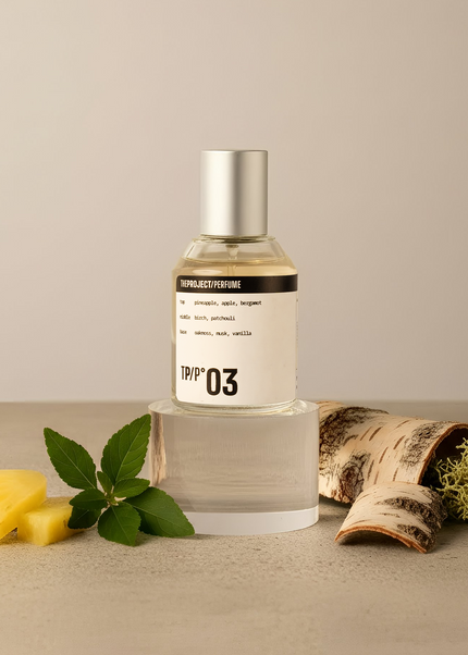 Perfume bottle labeled '03' with natural elements on a beige background